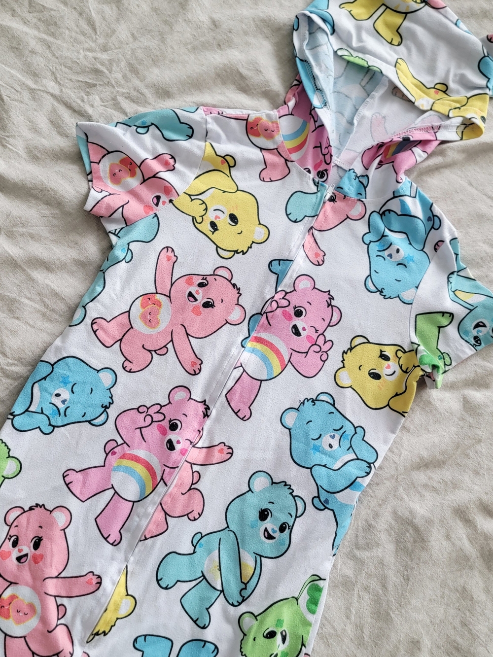 Care Bears Hooded Zip Romper in Pastel Pink Blue Yellow Green